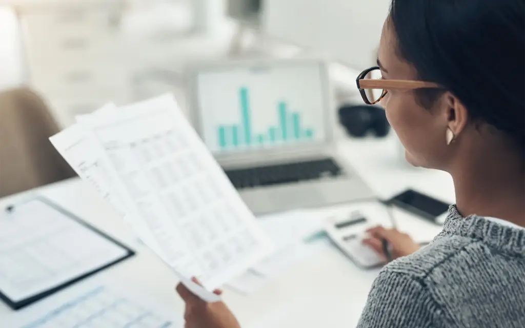 A woman reviewing compensation strategies