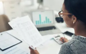 A woman reviewing compensation strategies