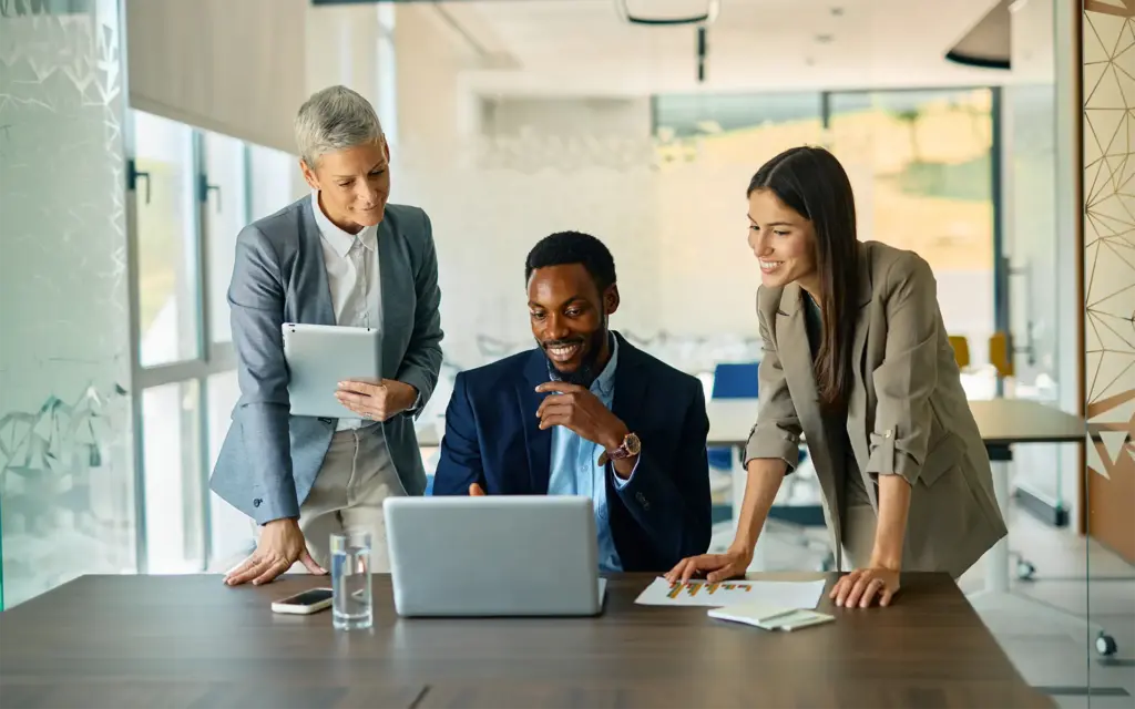 Three HR people having a conversation about finance